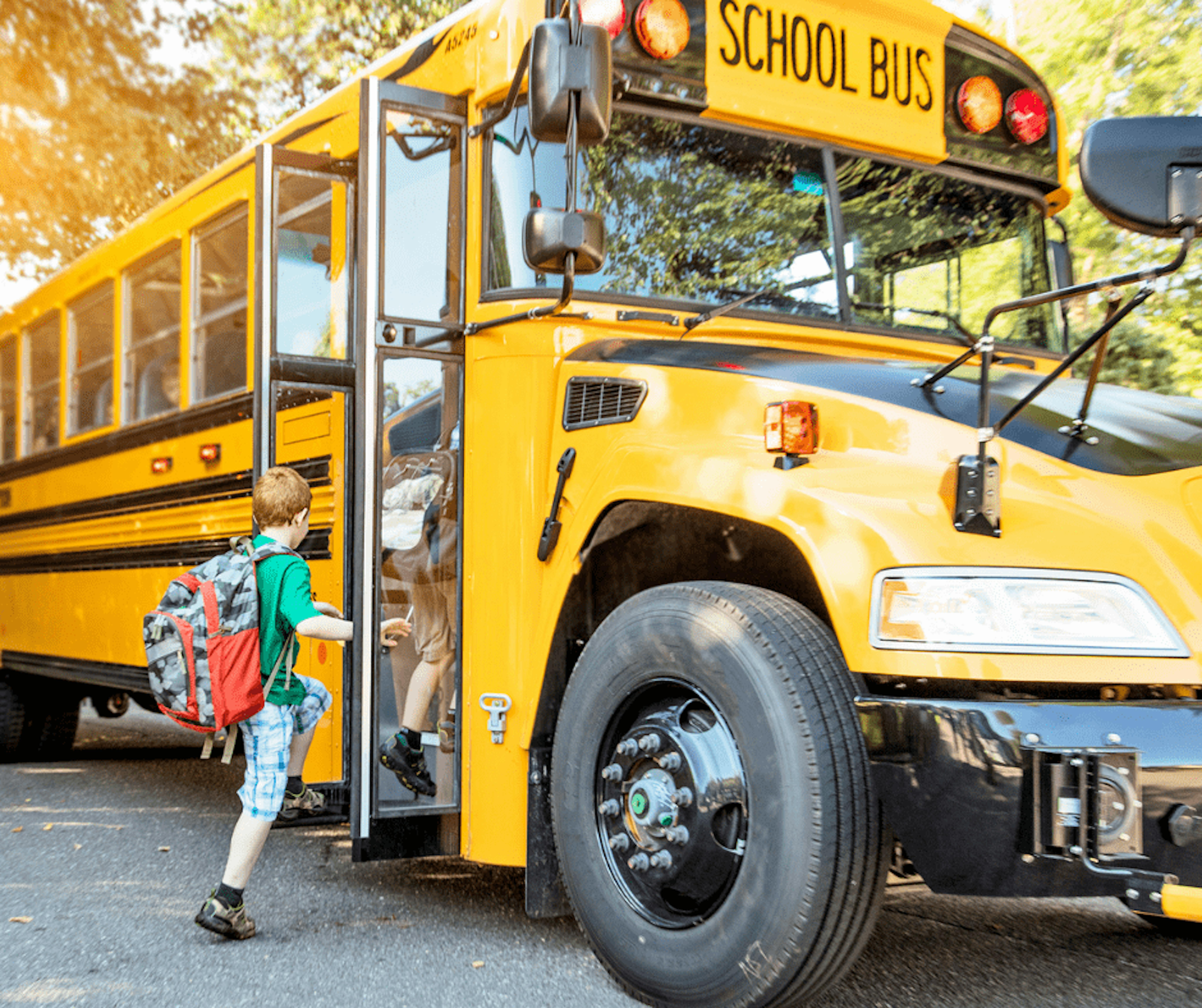 Kid boarding school bus